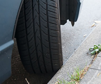 Parking on a hill when there is a curb present