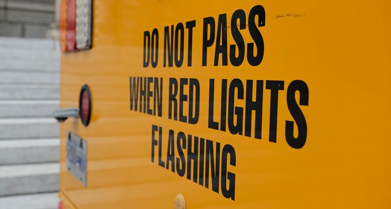 Stop When Red Lights on The Bus Are Flashing