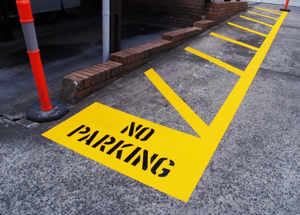 What does it mean when an area of road is painted with white diagonal  stripes and surrounded by a broken white line? - Theory Test